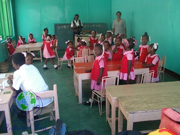 Group photo of Infinite Way team members with local religious sisters in Haiti