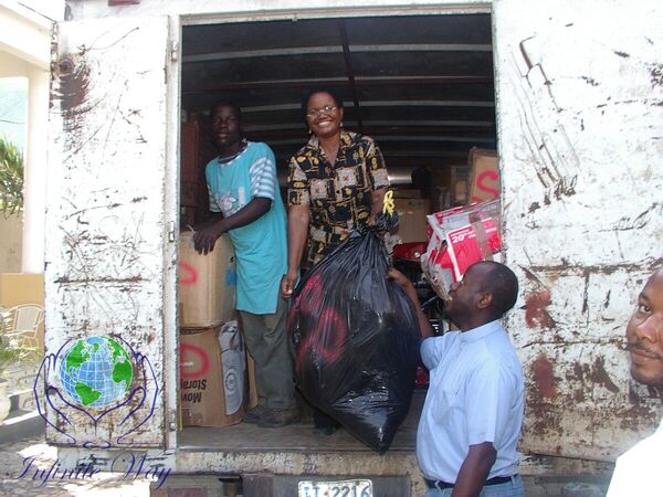 Volunteers in Infinite Way shirts coordinating relief efforts in Haiti